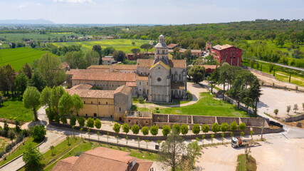Aerial view of Fossanova Abbey located in Priverno, in the province of Latina, Italy. The church is a national monument and a perfect example of the transition from Romanesque to Italian Gothic. - obrazy, fototapety, plakaty