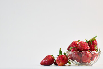 fresh strawberries in a glass bowl composition
