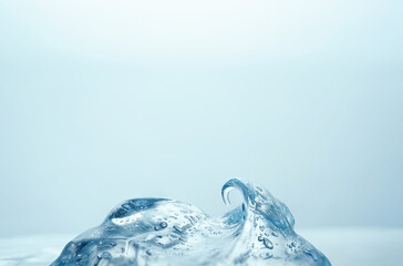 Moisturizing collagen gel with snail mucus for radiant skin on blue background