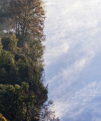 autumnal sunrise over the Adda River during a foggy morning, Lecco, Italy