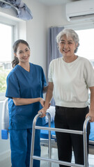 Asian senior care nurses and grandmothers provide caring support to elderly women hand clasp to encourage exercising with elder disabled person patient with caregiver in nursing care.