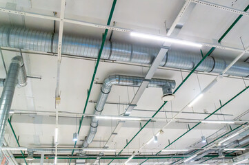 Ventilation pipes on the ceiling of an industrial building