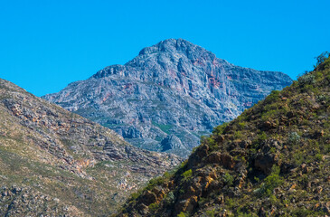 Seweweekspoort Peak. Nestled in the Klein Swartberg mountain range, Seweweekspoort Peak at  2325m is the highest peak in the Western Cape. The Peak is located in the Seweweeks Poort mountain pass.