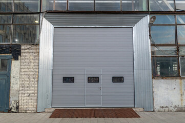 Fototapeta premium Entrance closed by a roller door to the industrial premises