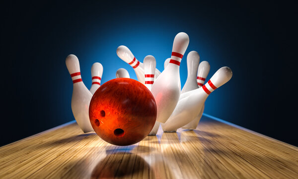 bowling ball hits pins falling on the track