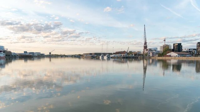 MOTION TIMELAPSE IN BORDEAUX WITH A BEAUTIFUL SUNSET AT THE EDGE OF THE WATER BASIN IN THE CITY CENTER