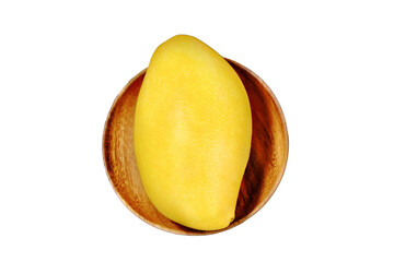 Ripe mango, isolated on a white background. Tropical fruit on a wooden saucer, close-up. Big yellow mango