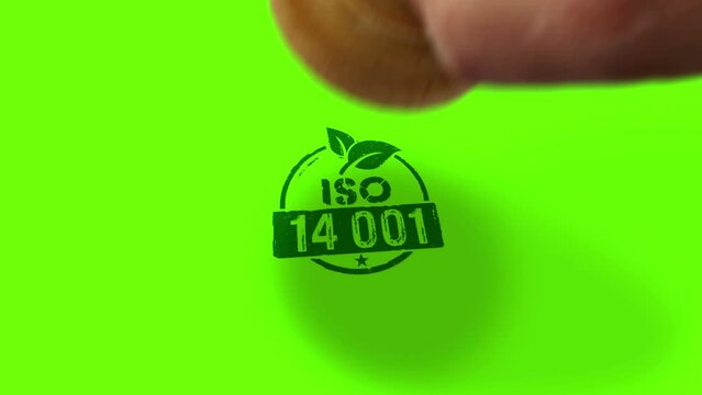 ISO 14001 certified stamp and hand stamping impact isolated animation. Environment ecology standard certificate 3D rendered concept. Alpha matte channel.