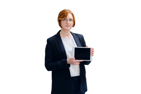 A teacher stands with an online learning tablet next to a blackboard, copy space, isolated on a white background. Problems of school education and Internet lessons in the coronavirus pandemic