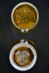 The surface of a glass of beer. Beer foam in a glass.