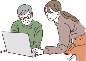 若い女性からパソコンを教わるシニア男性