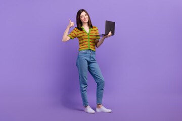 Full length photo of cute confident lady wear striped cardigan showing thumb up chatting gadget isolated purple color background