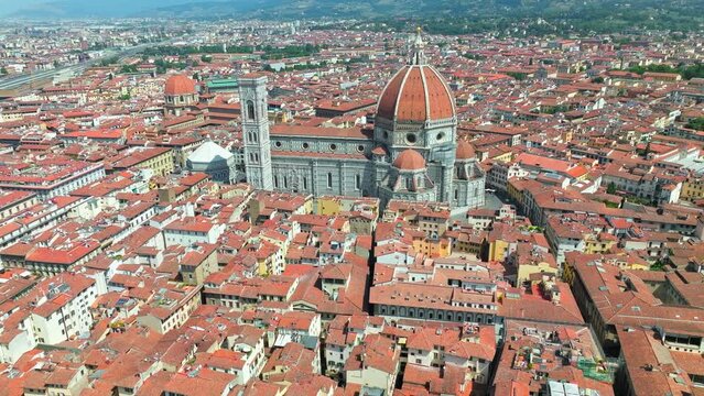 Aerial panoramic view of the Cathedral of Santa Maria del Fiore in Florence 4K. Top view from above of Tuscany iconic landmark with red-tiled dome, coloured marble facade in Italy, Europe in ProRes.