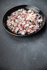octopus carpaccio salad seafood marinated spicy meal food snack on the table copy space food background rustic top view