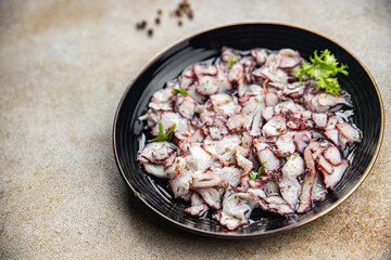 octopus carpaccio salad seafood marinated spicy meal food snack on the table copy space food background rustic top view