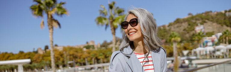 Happy and healthy woman enjoying good day outdoors