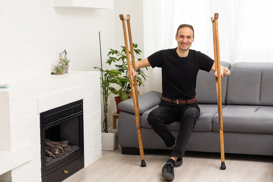 Young man with axillary crutches