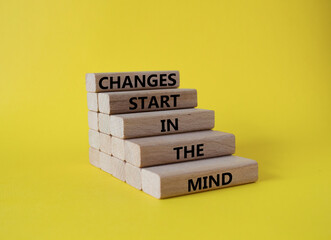 Changes start in the Mind symbol. Wooden blocks with words Changes start in the Mind. Beautiful...