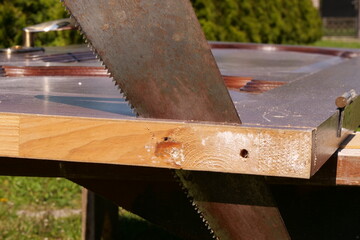 cutting the board with a hand saw