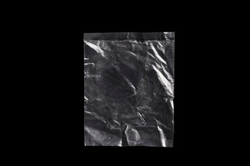 Transparent plastic bag isolated on black background.