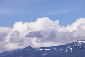 Puffy Clouds over Canadian Mountain Landscape, Sunny Day. Squamish, British Columbia, Canada. Nature Background.