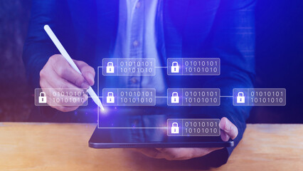 Businessman using a laptop computer to Blockchain technology concept with chain of encrypted blocks...