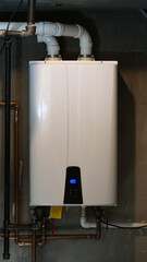 Tankless hot water heater installed in a home's boiler room.
