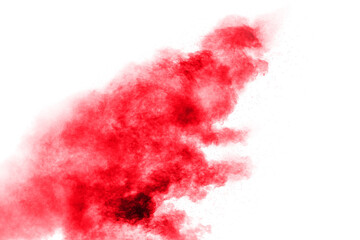 Abstract red dust splattered on white background. Red powder explosion.Freeze motion of red...