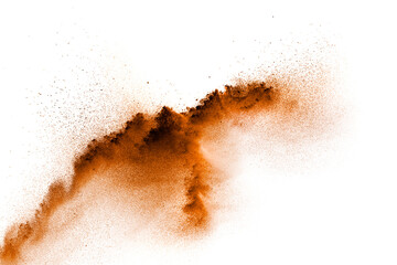 Brown dust exploding cloud.Brown particles splattered on white background.