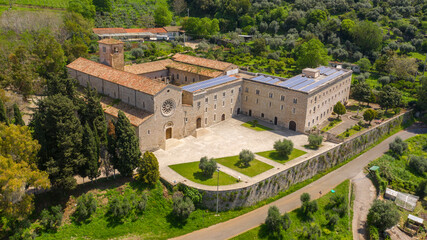 Fototapeta na wymiar Aerial view of Valvisciolo Abbey, a Cistercian monastery located in Sermoneta, in the province of Latina, Italy. The church has a rose window and is a masterpiece of Romanesque-Cistercian architecture