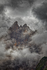 View of the peaks of the Sesto Dolomites through clouds and fog, Alps, South Tyrol, Italy, Europe