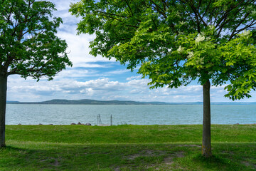 free beach on Lake Balaton with trees and nature in Balatonlelle Hungary