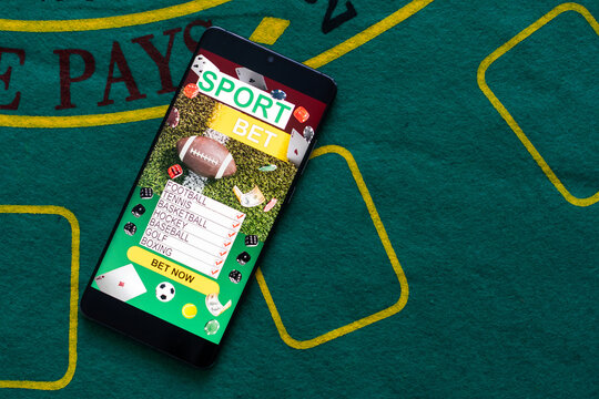 Smartphone with gambling mobile application. Sport and betting concept