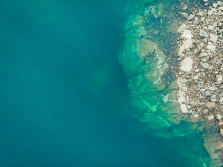 Blue water and rocks, view from above