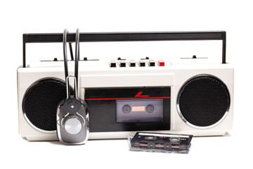 Retro portable stereo cassette recorder from 80s. with headphones and Audio cassette tape.