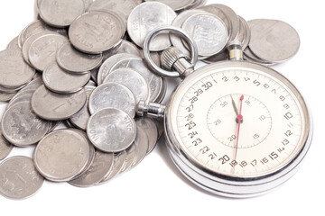Time is money. Stopwatch and stacks of Indian rupees coins