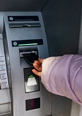 Woman Using Credit Card and Atm Machine