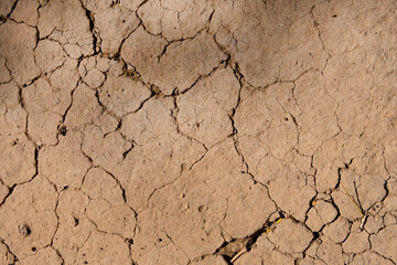 Wall texture soil dry crack pattern of drought lack of water of nature brown old broken background.