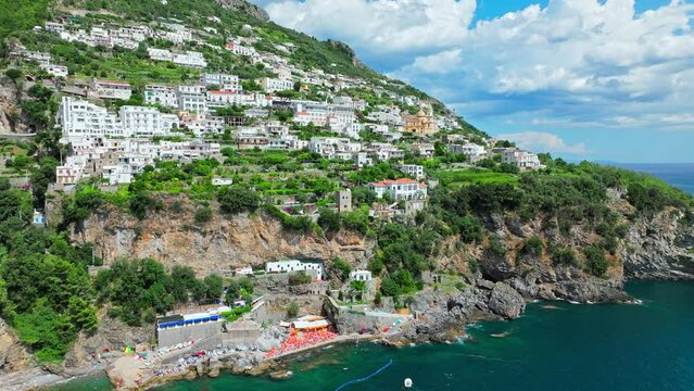 Aerial view of Lido One Fire Beach with Praiano Town Background o Amalfi Coast. Panoramic view of Praiano town and comune of the province of Salerno in the Campania region between Amalfi and Positano.