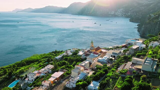 Scenic sunset over Praiano Town on the Amalfi Coast with Mediterranean Sea views. Beautiful drone view of the Italian prime tourist location between the towns of Amalfi and Positano in ProRes 4K