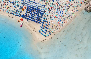 Fotobehang La Pelosa Strand, Sardinië, Italië Aerial view of beautiful beach with white sand, colorful umbrellas, swimming people in blue sea at summer sunny day. La Pelosa beach, Sardinia, Italy. Top drone view of sandy beach, transparent water