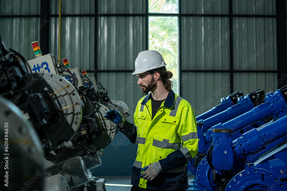Aufkleber engineer inspect robotic arm in workshop,checking quality of workpieces manufacturing industry techn