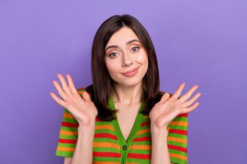 Photo of unsure funky woman dressed striped cardigan shrugging shoulders isolated violet color background