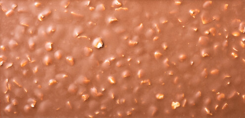 Milk chocolate bar with nuts texture top view