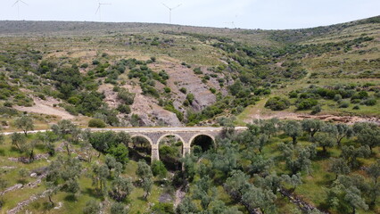 Tatar Bridge - Very old stone arch bridge from Ottoman or even older times about 30 m long with three arches, 2 central piers, completely preserved near Urla, Turkish Aegean Sea
