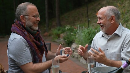 Gay man proposes marriage to another man with a surprise ring for an engagement.
