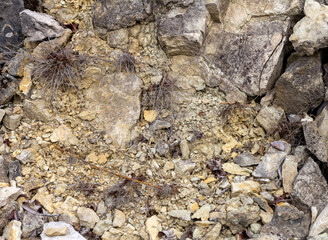 the wall is made of natural material, the stone is a limestone material of volcanic origin, close-up.