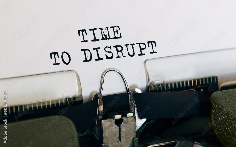 Poster text time to disrupt typed on retro typewriter