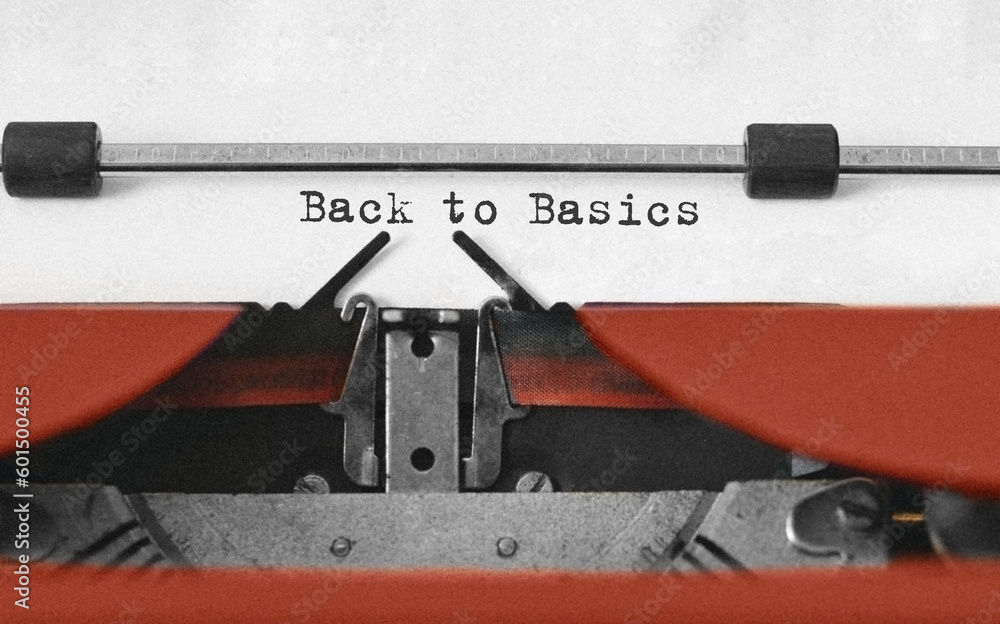 Poster text back to basics typed on retro typewriter