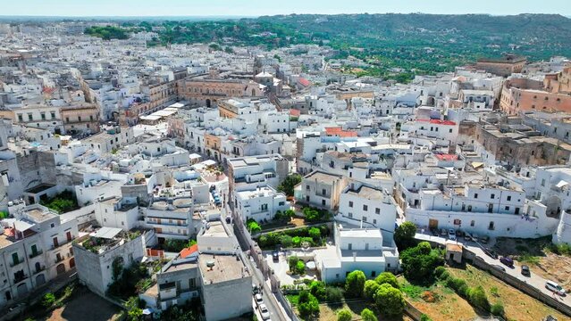 View from above over Ostuni city in Italy&rsquo;s Apulia region. Close up aerial view of the Cathedral with its fascinating Byzantine, Gothic and Romanesque styles to the stunning Piazzetta Cattedrale.